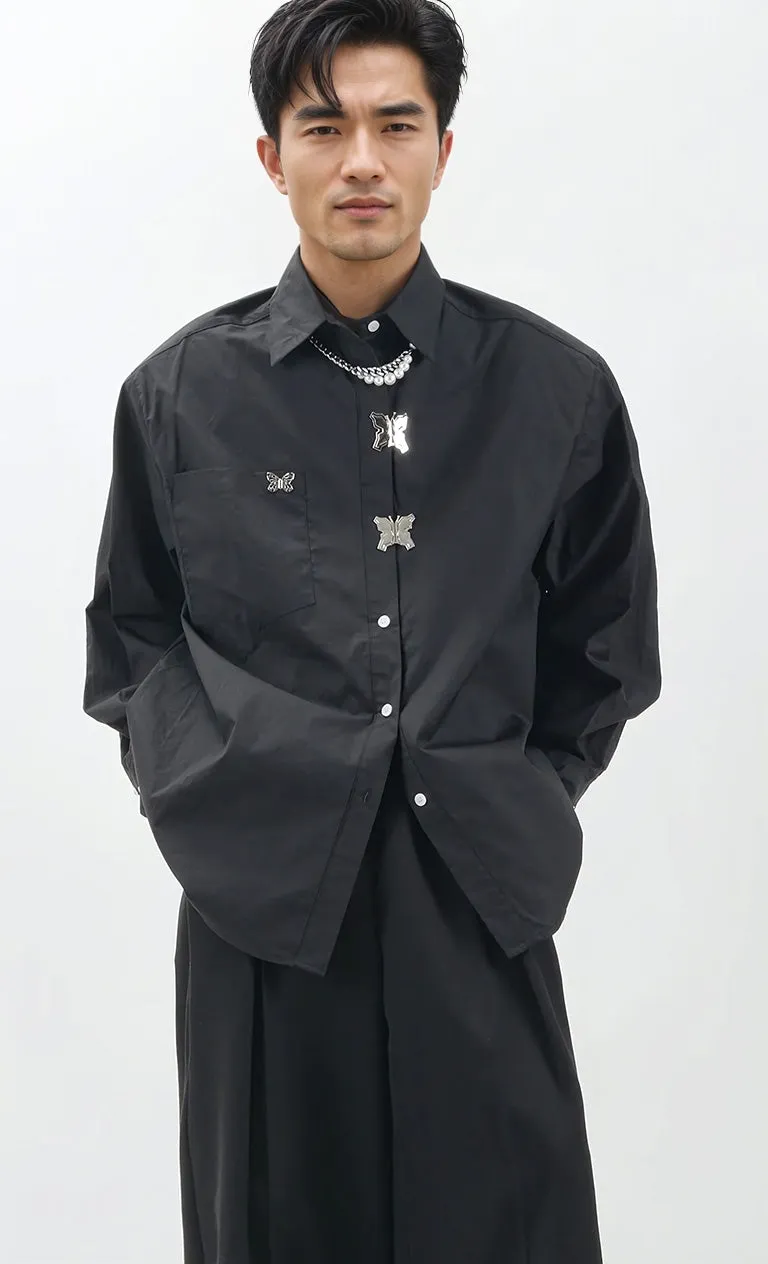 Oversized Shoulder-Padded Shirt with Metallic Brooch Accents